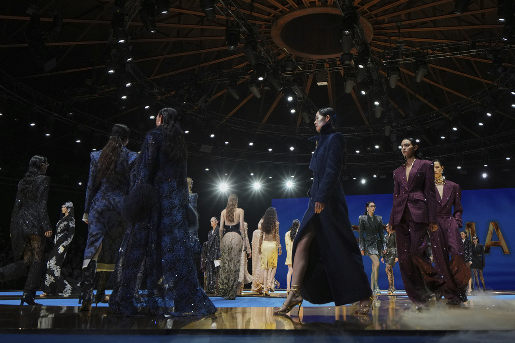 Models present creations by Maggie Ma collection during the SS2026 China Fashion Week, in Beijing, China, Tuesday, Sept. 9, 2025. (AP Photo/Andy Wong)