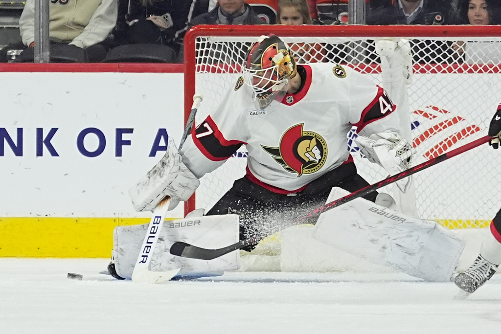 Ottawa Senators goaltender James Reimer blocks a shot during the third period of an NHL hockey game against the Philadelphia Flyers, Thursday, Feb. 5, 2026, in Philadelphia. (AP Photo/Matt Rourke)