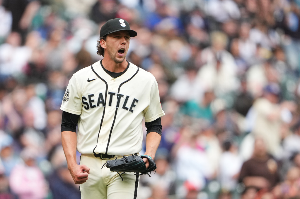 Seattle Mariners starting pitcher Logan Gilbert reacts after Houston Astros' Isaac Paredes hit into a double play to end the top of the sixth inning of a baseball game, Sunday, April 12, 2026, in Seattle. (AP Photo/Lindsey Wasson)