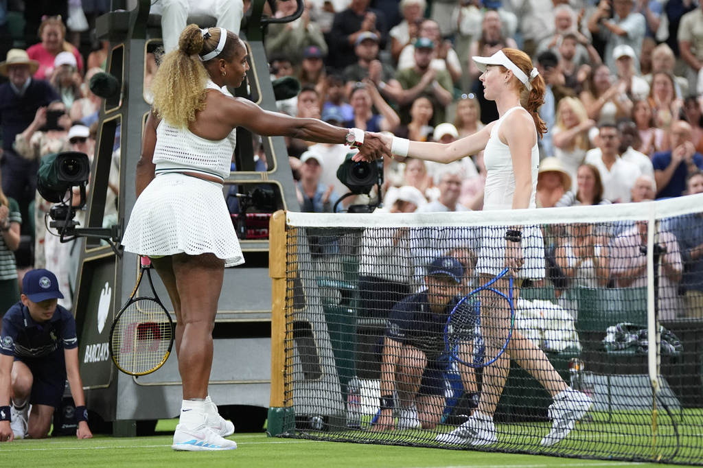 Serena Williams of the United States, left, and Maya Joint of Australia shake hands at the end of their first round women's singles match at the Wimbledon Tennis Championships in London, Tuesday, June 30, 2026. (AP Photo/Maja Smiejkowska)