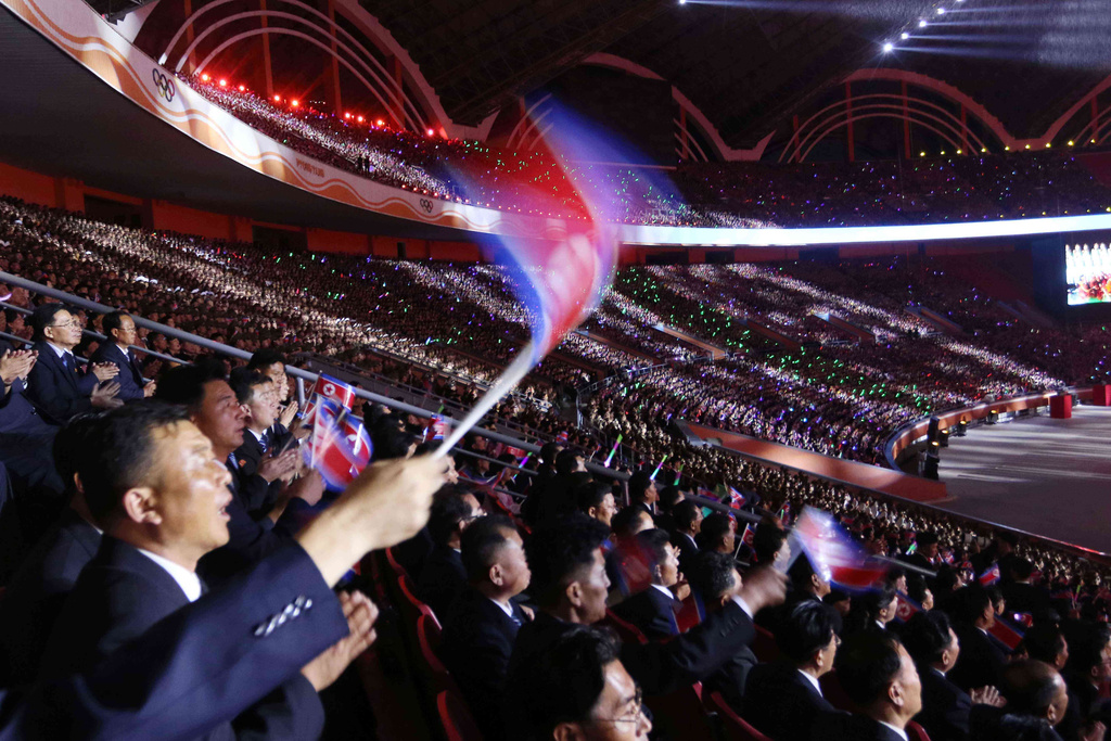 People watch the mass gymnastics and artistic performance during the ceremony marking the 80th founding anniversary of the ruling Workers' Party at the May Day Stadium in Pyongyang, North Korea, Thursday evening, Oct. 9, 2025. (AP Photo/Cha Song Ho)