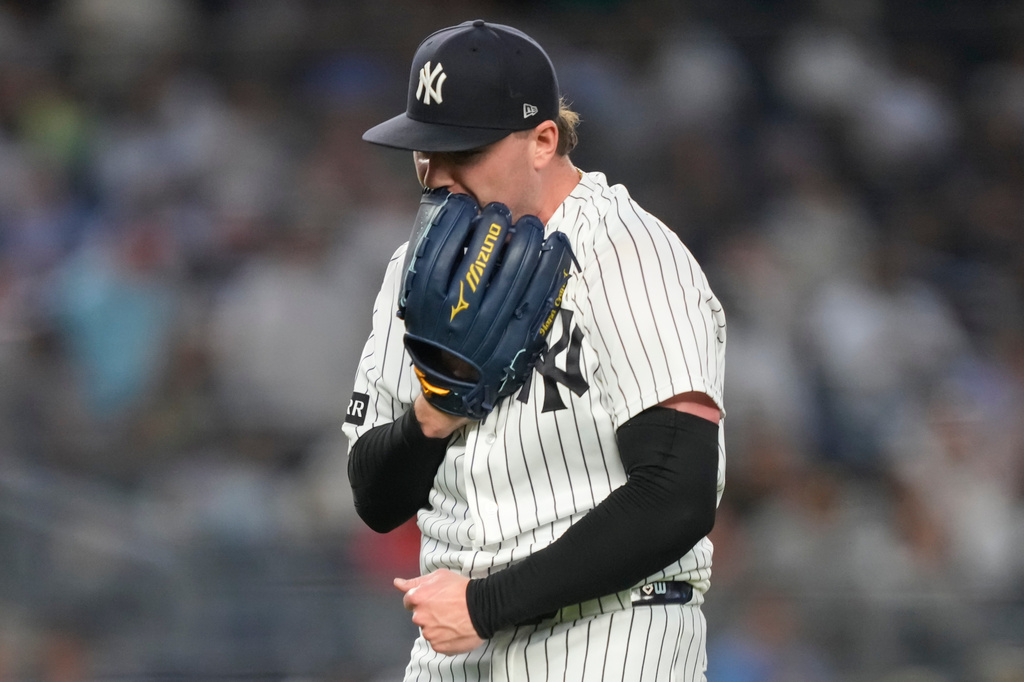 New York Yankees pitcher Ryan Weathers yells into his glove as he walks to dugout during the second inning of a baseball game against the Los Angeles Angels, Tuesday, April 14, 2026, in New York. (AP Photo/Yuki Iwamura)