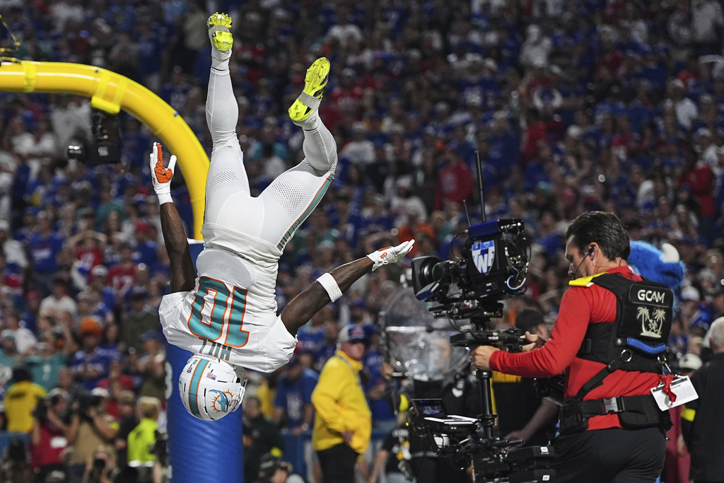 Miami Dolphins wide receiver Tyreek Hill (10) celebrates after scoring a touchdown against the Buffalo Bills during the second half of an NFL football game, Thursday, Sept. 18, 2025, in Orchard Park, N.Y. (AP Photo/Matt Rourke)