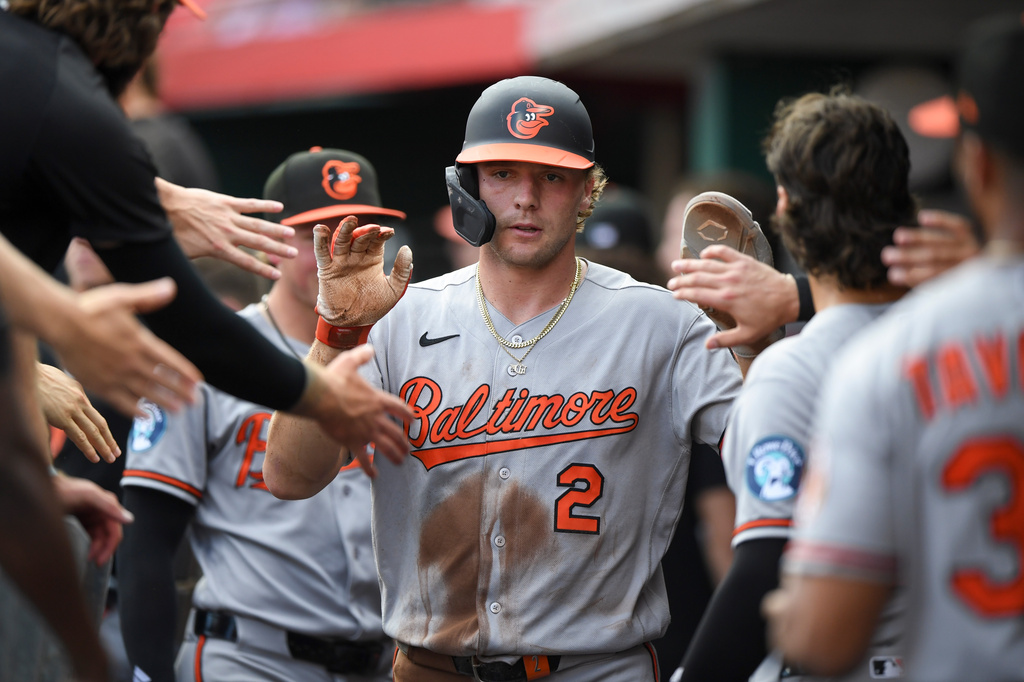 Baltimore Orioles' Gunnar Henderson celebrates with teammates after scoring during the first inning of a baseball game against the Cincinnati Reds in Cincinnati, Friday, July 3, 2026. (AP Photo/Tanner Pearson)