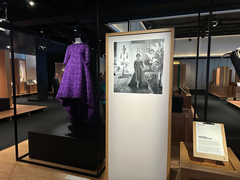 A violet evening gown designed by Cristobal Balenciaga as worn by American socialite Mona von Bismarck is pictured on display as part of the Comite Colbert "Hidden Treasures" exhibit at The Shed on Tuesday, May 26, 2026, in New York. (AP Photo/Beatrice Dupuy)