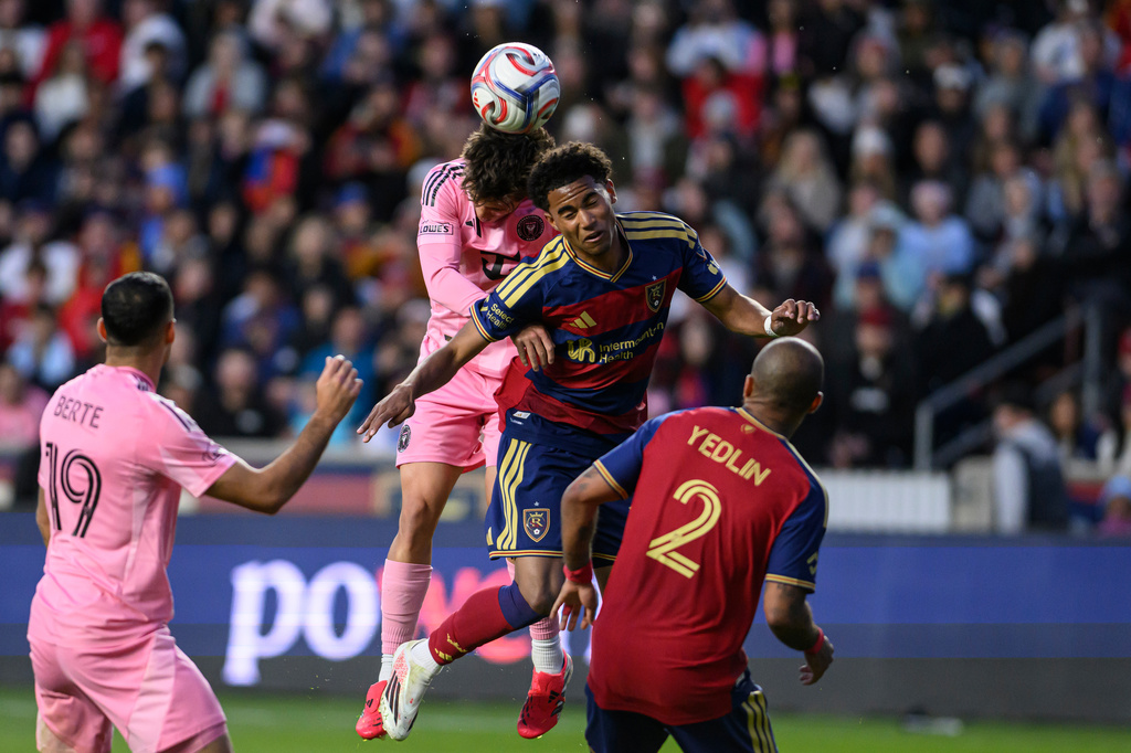 Real Salt Lake midfielder Zavier Gozo, center right, heads the ball away from Inter Miami defender Sergio Reguilón, center left, during an MLS soccer match, Wednesday, April 22, 2026, in Sandy, Utah. (AP Photo/Tyler Tate) CORRECTION-Corrects to midfielder Zavier Gozo in stead of Pablo Ruiz.