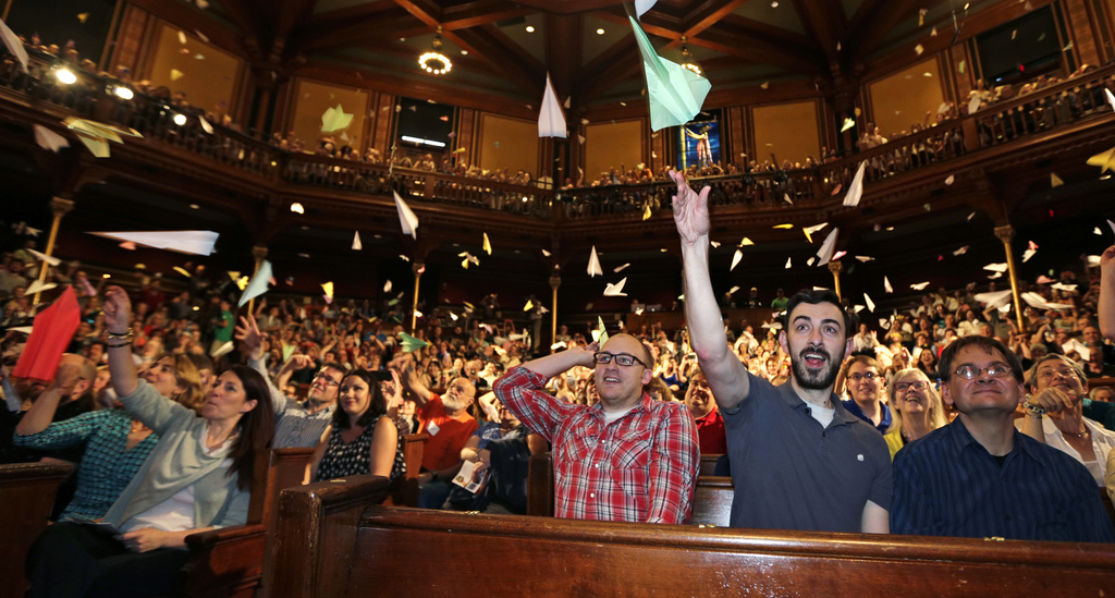 FILE - Audience members launch paper airplanes during a performance at the Ig Nobel Prize ceremony, in Cambridge, Mass., Thursday, Sept. 17, 2015. The Ig Nobel prize is an award handed out by the Annals of Improbable Research magazine for silly sounding scientific discoveries that often have surprisingly practical applications. (AP Photo/Charles Krupa, File)