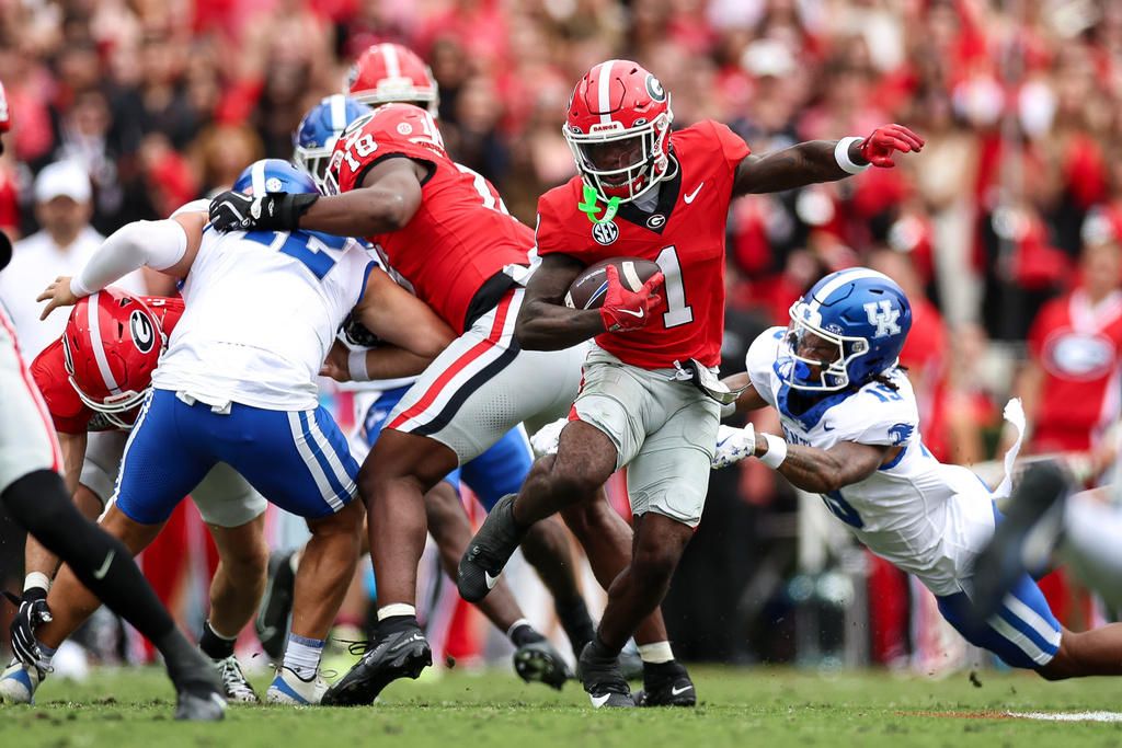 Georgia wide receiver Zachariah Branch (1) runs with the ball during the first half of an NCAA college football game against Kentucky, Saturday, Oct. 4, 2025, in Athens, Ga. (AP Photo/Colin Hubbard)