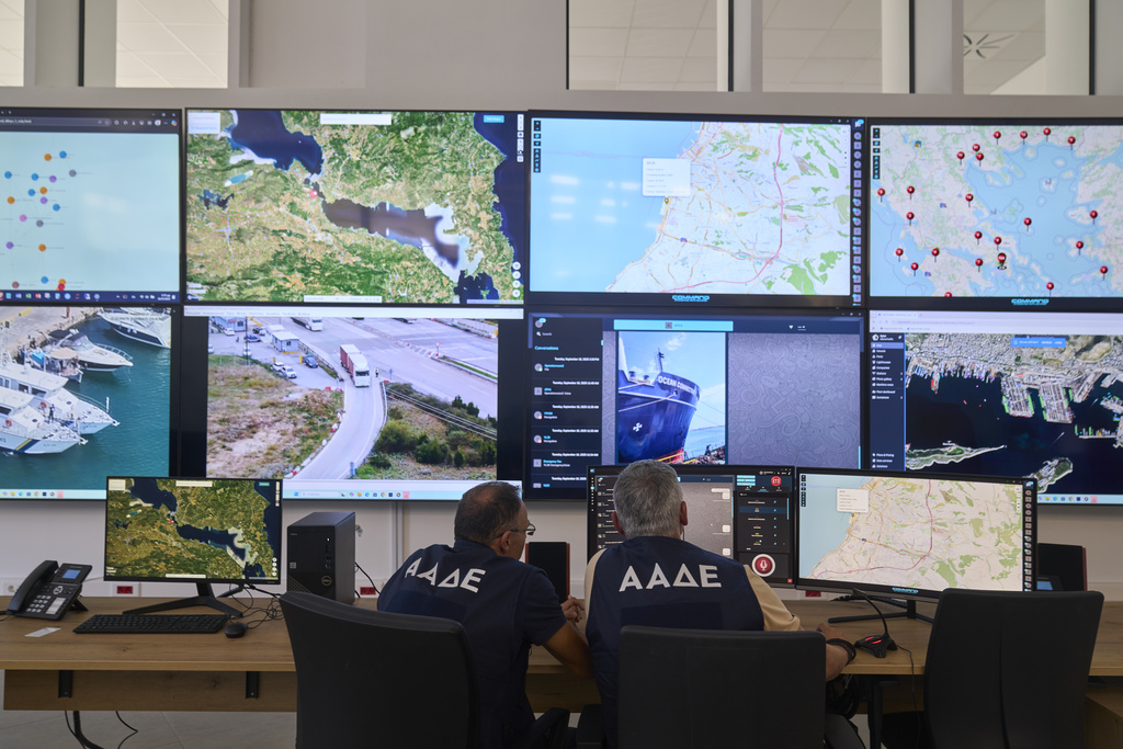 Inspectors of the Independent Authority for Public Revenue monitor transactions in real time at the headquarters of AADE in Athens, Greece, Tuesday, Sept. 16, 2025. (AP Photo/Petros Giannakouris)