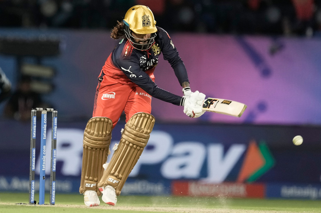 Royal Challengers Bengaluru's captain Rajat Patidar plays a shot during the Indian Premier League cricket match between Gujarat Titans and Royal Challengers Bengaluru in Dharamshala, India, Tuesday, May 26, 2026. (AP Photo/Ashwini Bhatia)
