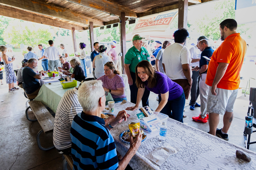 Christina Bohannan, Democratic candidate for U.S. House, speaks to voters during the Scott County Democrats Annual Family Picnic, in Bettendorf, Iowa. Sunday, Aug. 16, 2026. (AP Photo/Joseph Cress)