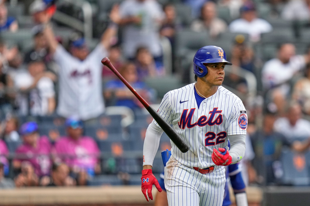 New York Mets' Juan Soto throws his bat after hitting a solo home run during the seventh inning of a baseball game against the Kansas City Royals, Thursday, July 9, 2026, in New York. (AP Photo/Seth Wenig)