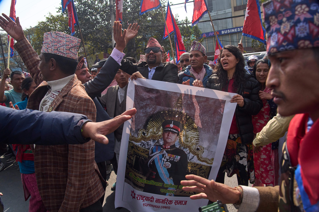 Supporters gather to welcome Nepal's former King Gyanendra Shah upon his arrival at Tribhuvan International Airport in Kathmandu, Nepal, Friday, Feb. 13, 2026. (AP Photo/Niranjan Shrestha)
