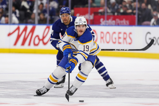 Buffalo Sabres' Peyton Krebs (19) carries the puck down ice during the first period of an NHL hockey game against the Toronto Maple Leafs in Toronto, Saturday, Oct. 25, 2025. (Nick Iwanyshyn/The Canadian Press via AP) Buffalo Sabres' Peyton Krebs (19) carries the puck down ice during the first period of an NHL hockey game against the Toronto Maple Leafs in Toronto, Saturday, Oct. 25, 2025. (Nick Iwanyshyn/The Canadian Press via AP)