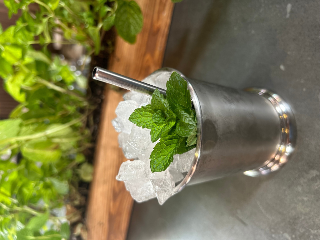 A Mint Julep cocktail is displayed at the cocktail bar Cato in London on April 22, 2026. (AP Photo/Louise Dixon)