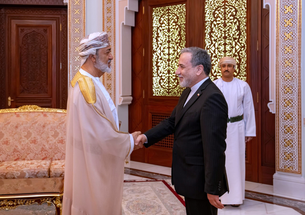 In this photo released by the Iranian Foreign Ministry, Iranian Foreign Minister Abbas Araghchi, right, shakes hands with Oman's Sultan Haitham bin Tariq during their meeting, in Muscat, Oman, Sunday, April 26, 2026. (Iranian Foreign Ministry via AP)