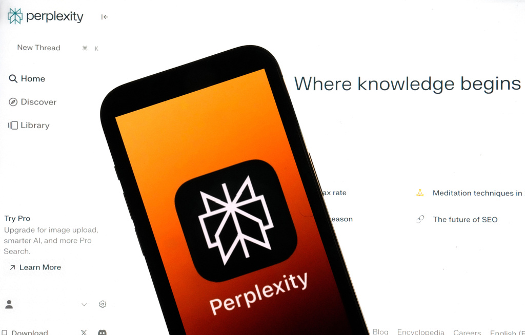 FILE - The Perplexity website and logo are shown in this photo, in New York, Friday, July 5, 2024. (AP Photo/Richard Drew, File)