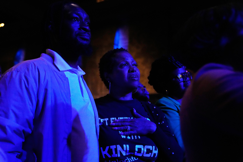 Attendees react during an election night watch party for Detroit mayoral candidate Solomon Kinloch on Tuesday, Nov. 4, 2025, in Detroit. (AP Photo/Ryan Sun)