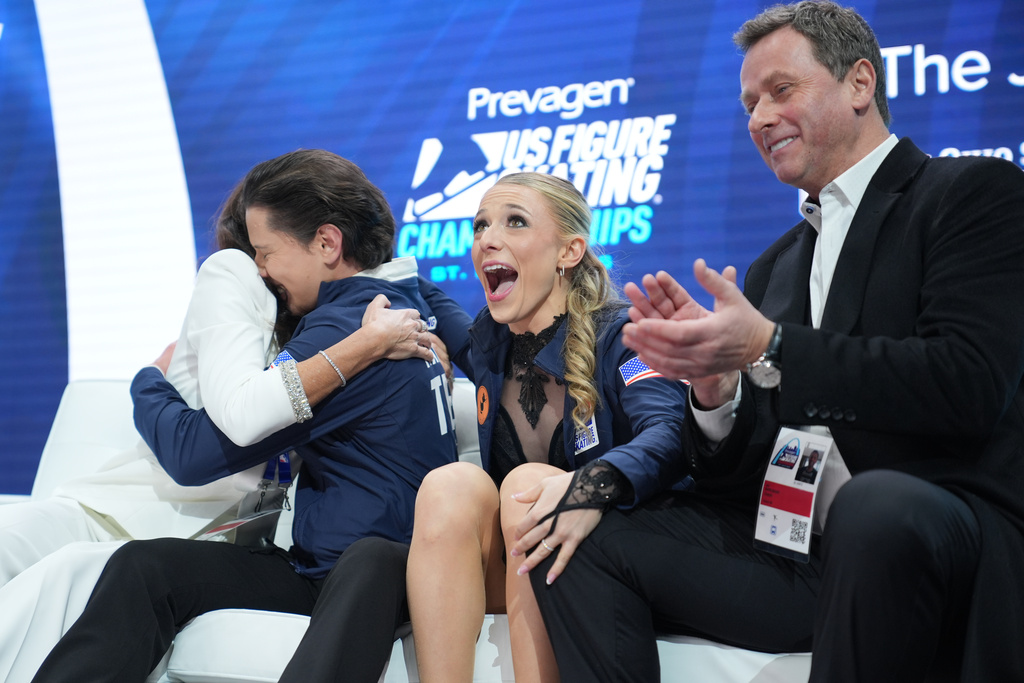 Emilea Zingas and Vadym Kolesnik react to their scores after the free dance competition at the U.S. Figure Skating Championships, Saturday, Jan. 10, 2026, in St. Louis. (AP Photo/Stephanie Scarbrough)