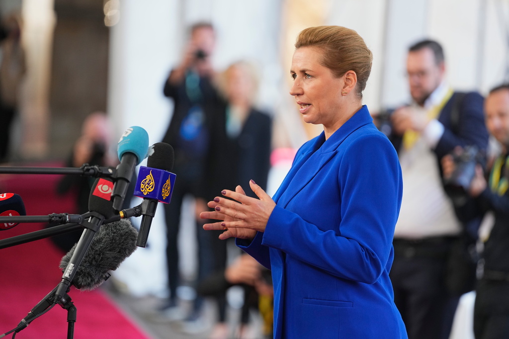 Denmark's Prime Minister Mette Frederiksen speaks to journalists as she arrives for an informal summit in the Danish parliament at Christiansborg Castle in Copenhagen, on Wednesday, Oct. 1, 2025. (Thomas Traasdahl/Ritzau Scanpix via AP)