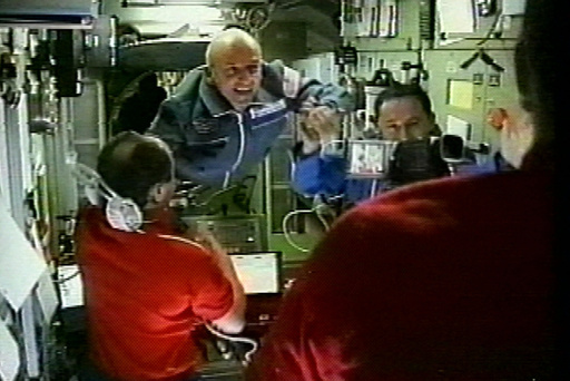 FILE - In this image from television, space station commander Yury Usachev, left, welcomes California millionaire Dennis Tito, center, and Russian cosmonauts Talgat Musabayev, right, to the International Space Station on Monday, April 30, 2001. (AP Photo/APTN, File) FILE - In this image from television, space station commander Yury Usachev, left, welcomes California millionaire Dennis Tito, center, and Russian cosmonauts Talgat Musabayev, right, to the International Space Station on Monday, April 30, 2001. (AP Photo/APTN, File)