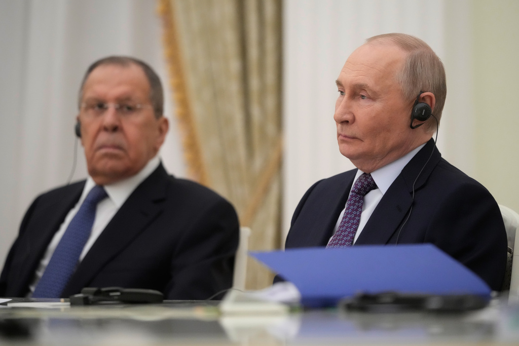 Russian President Vladimir Putin, right, and Russian Foreign Minister Sergey Lavrov listen to Cuban Foreign Minister Bruno Rodriguez Parrilla, during their talks at the Senate Palace of the Kremlin in Moscow, Wednesday, Feb. 18, 2026. (AP Photo/Pavel Bednyakov, Pool)