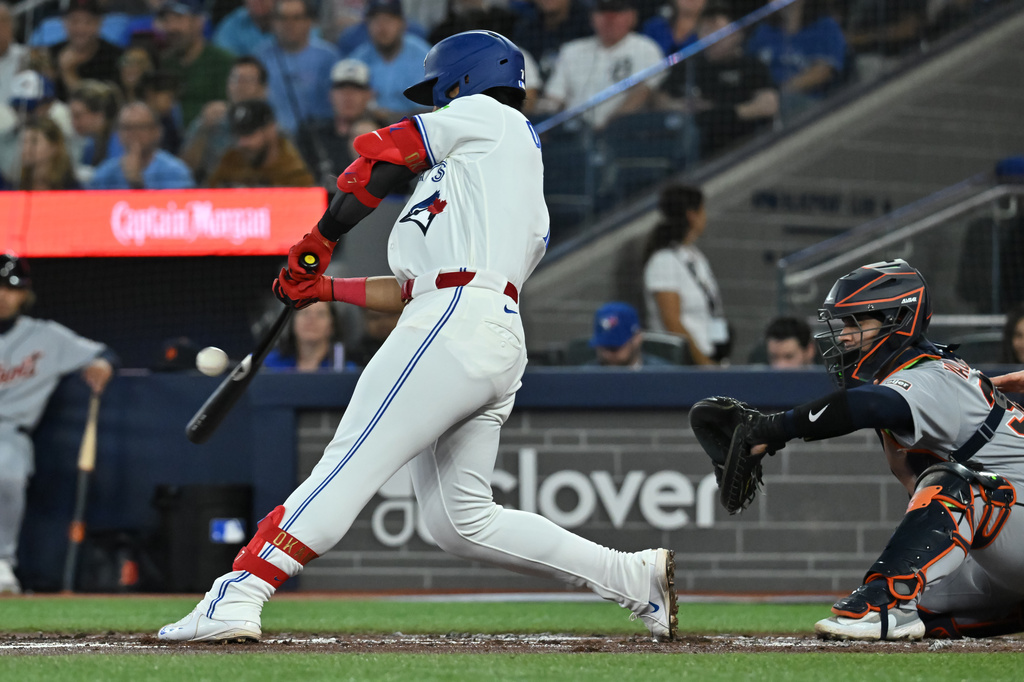Toronto Blue Jays' Kazuma Okamoto (7) hits a single against the Detroit Tigers during the second inning of a baseball game in Toronto, Tuesday, Sept. 15, 2026. (Jon Blacker/The Canadian Press via AP)