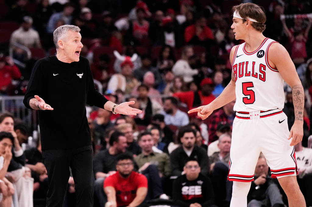 Chicago Bulls head coach Billy Donovan, left, talks with guard Mac McClung (5) during the second half of an NBA basketball game against the Orlando Magic in Chicago, Friday, April 10, 2026. (AP Photo/Nam Y. Huh)