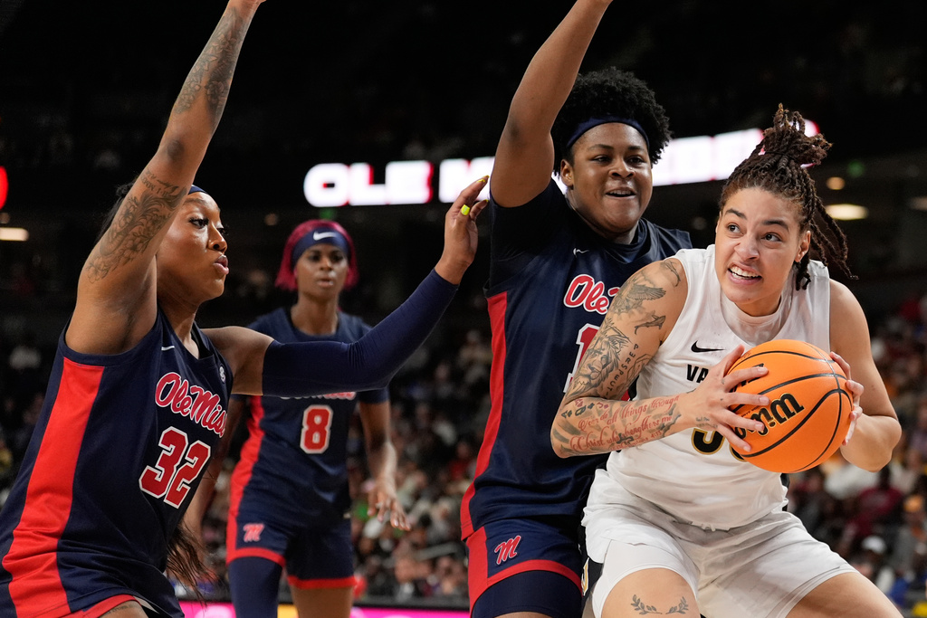 Vanderbilt forward Sacha Washington =drive around Mississippi during second half of an NCAA college basketball game in the quarterfinals of the Southeastern Conference tournament, Friday, March 6, 2026, in Greenville, S.C. (AP Photo/Chris Carlson)