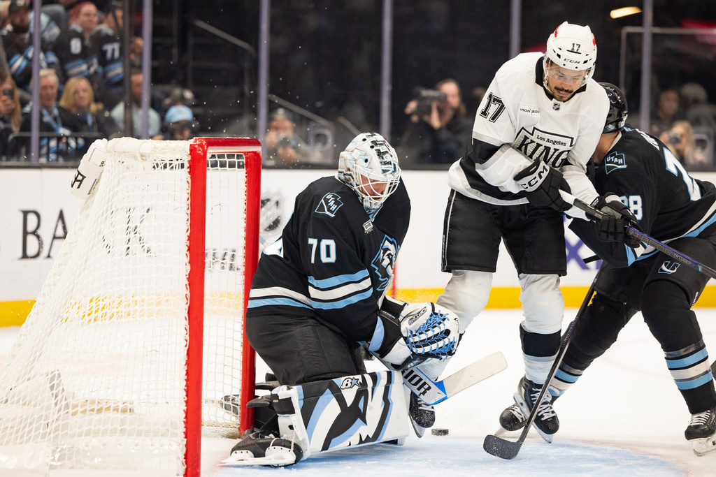 Los Angeles Kings right wing Mathieu Joseph (17) gets defended at the goal by Utah Mammoth goaltender Karel Vejmelka (70) and defenseman Ian Cole (28) during the second period of an NHL hockey game, Sunday, March 22, 2026, in Salt Lake City. (AP Photo/Melissa Majchrzak)