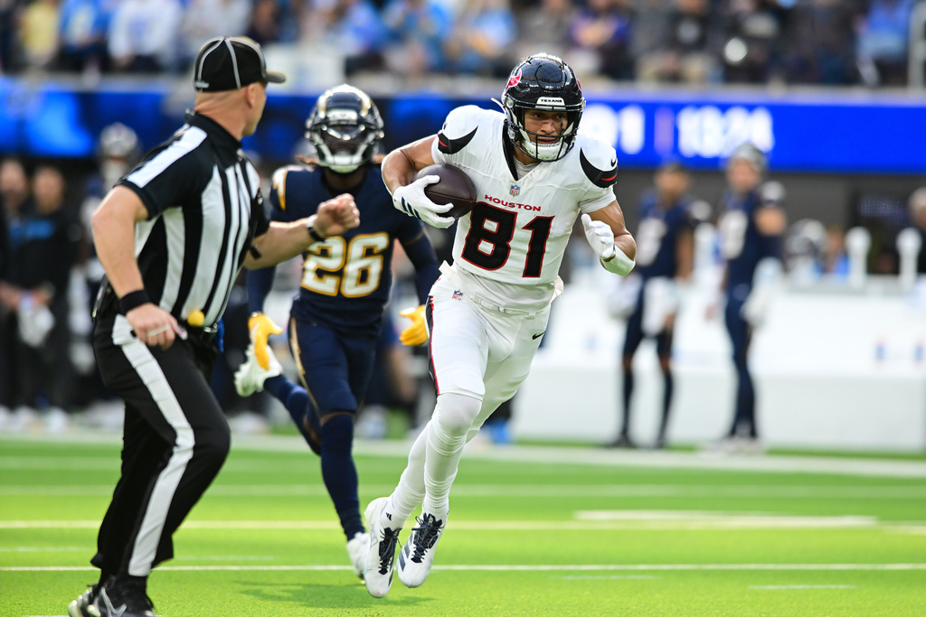 Houston Texans wide receiver Jayden Higgins (81) runs toward the end zone for a touchdown during the first half of an NFL football game against the Los Angeles Chargers Saturday, Dec. 27, 2025, in Inglewood, Calif. (AP Photo/Wally Skalij)