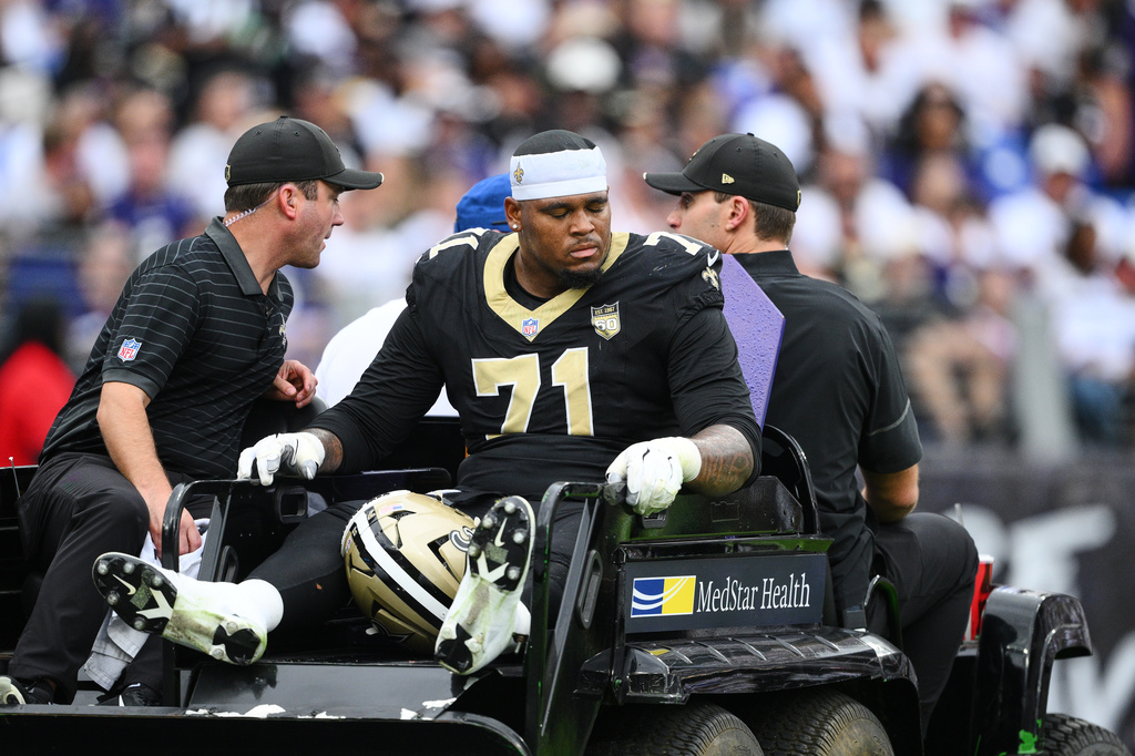 New Orleans Saints offensive tackle Kelvin Banks Jr. (71) is carted off the field after being injured in the second half of an NFL football game against the Baltimore Ravens in Baltimore, Sunday, Sept. 20, 2026. (AP Photo/Nick Wass)