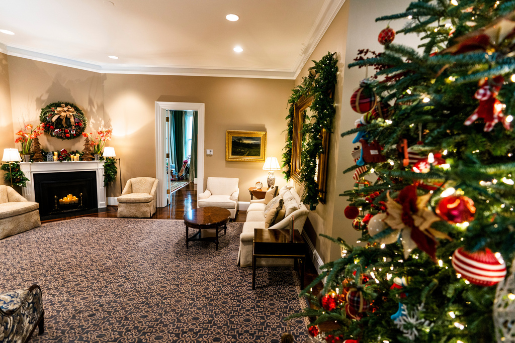 FILE - The vice president's official residence living room is decorated with a Christmas tree featuring whimsical old fashioned toys and a Christmas wreath above a fireplace Monday, Nov. 30, 2020 in Washington. (AP Photo/Manuel Balce Ceneta, File)