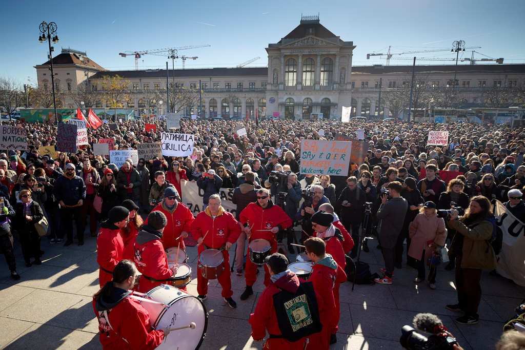 Protesters hold placards during a protest march against the surging far right following a spate of incidents targeting ethnic minorities and liberals, in Zagreb, Croatia, Sunday, Nov. 30, 2025. (AP Photo)