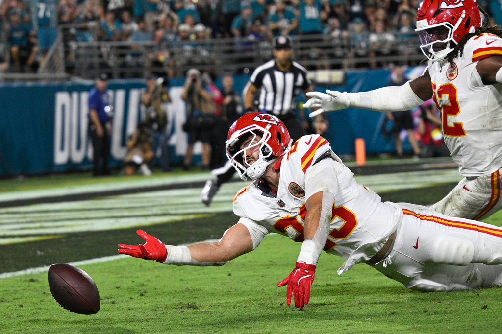 Kansas City Chiefs linebacker Drue Tranquill (23) can't catch the ball for a interception during the first half of an NFL football game against the Jacksonville Jaguars, Monday, Oct. 6, 2025, in Jacksonville, Fla. (AP Photo/Phelan M. Ebenhack)