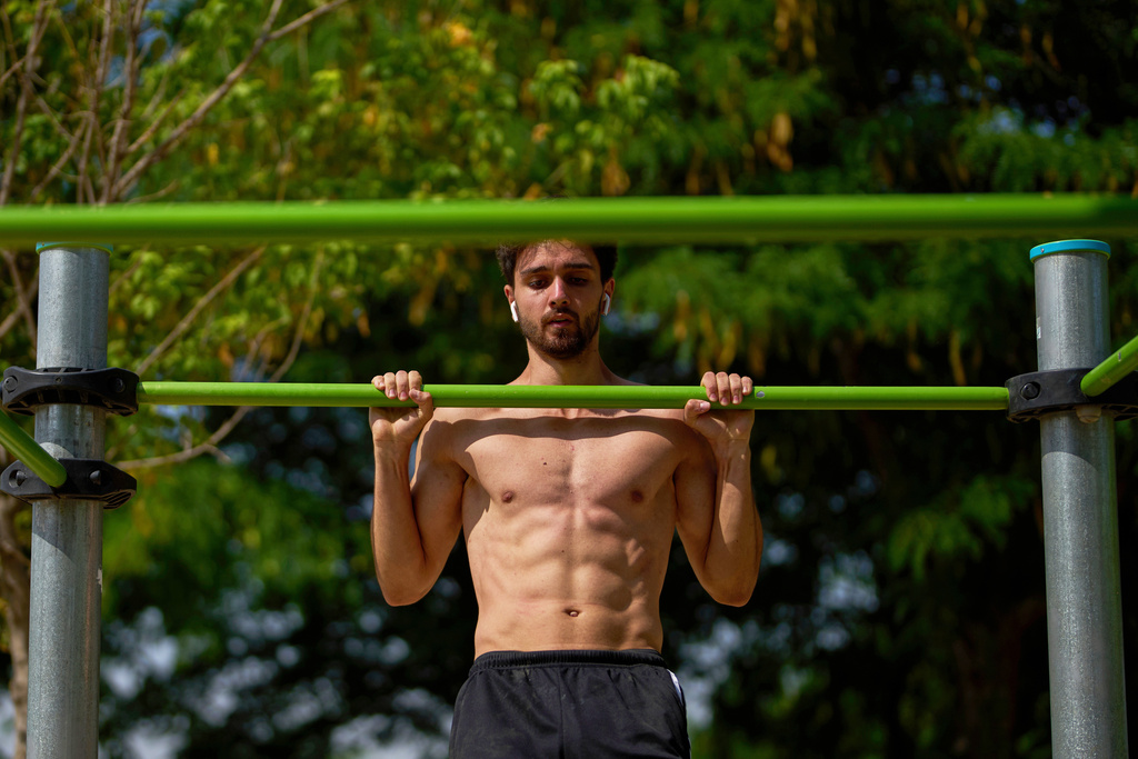 FILE - A man works out in a public park in Madrid, Spain on July 1, 2025. (AP Photo/Manu Fernandez, File)