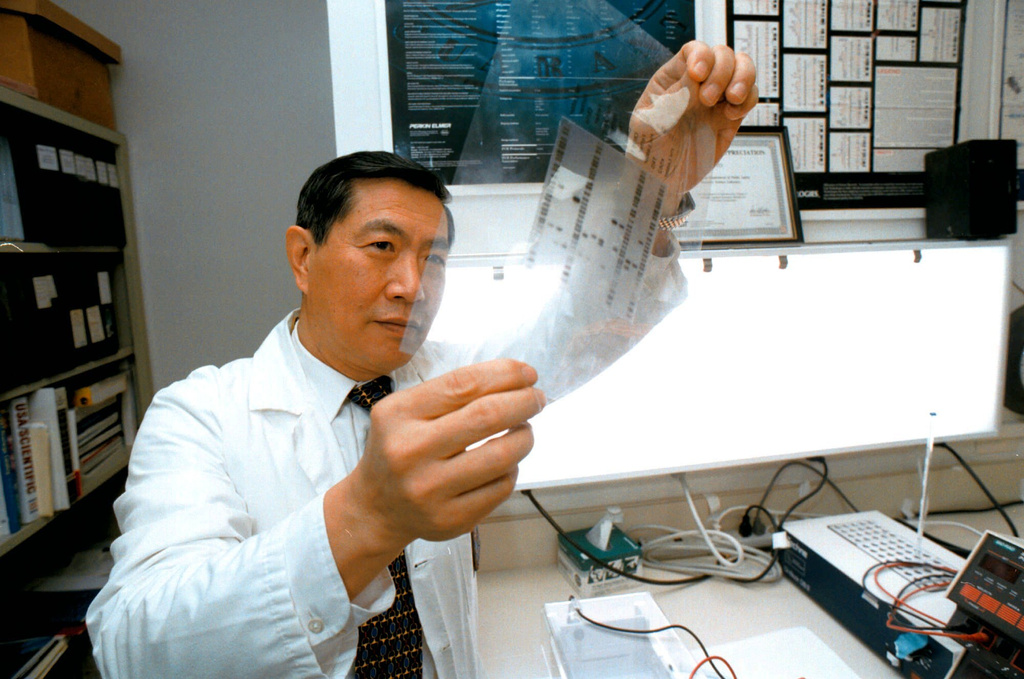 FILE - Henry C. Lee, head of the Connecticut State Forensic Laboratory examines a DNA profile that is now included in a state database computer system in Meriden, Conn., Jan. 28, 1997. (AP Photo/Steve Miller, File)