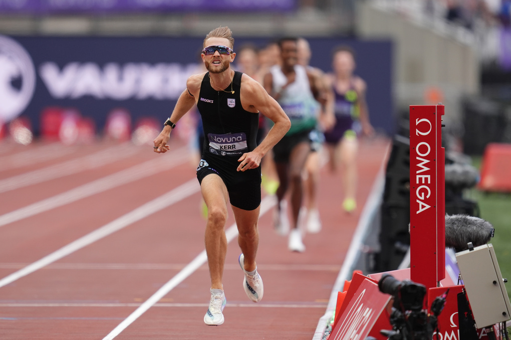Britain's Josh Kerr wins and breaks a world record in the Men's 1 Mile final during the Novuna London Athletics Meet at the London Stadium, Saturday July 18, 2026. (Adam Davy/PA via AP)