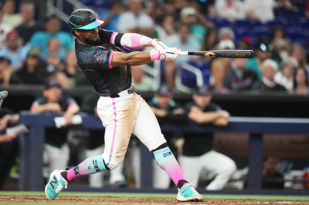 Miami Marlins' Otto Lopez hits a two run home run during the sixth inning of a baseball game against the Milwaukee Brewers, Friday, April 17, 2026, in Miami. (AP Photo/Lynne Sladky)