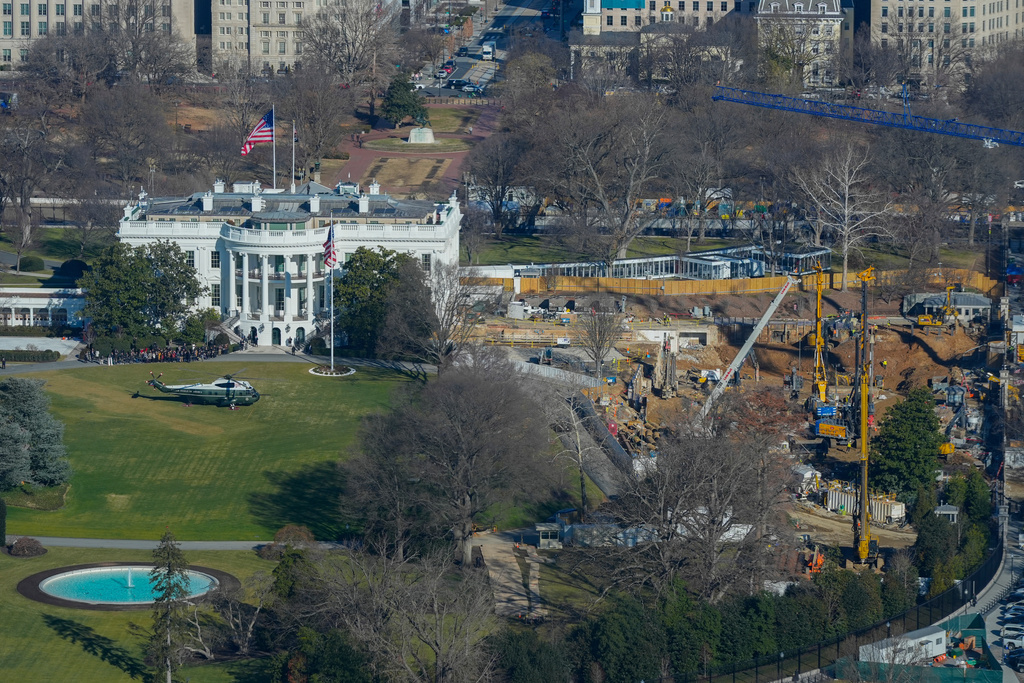 Marine One helicopter is seen on the South Lawn of the White House to transport President Donald Trump to nearby Andrews Air Force Base, as work continues on the construction of the ballroom at the White House, Tuesday, Jan., 13, 2026, in Washington, where the East Wing once stood. (AP Photo/Pablo Martinez Monsivais)