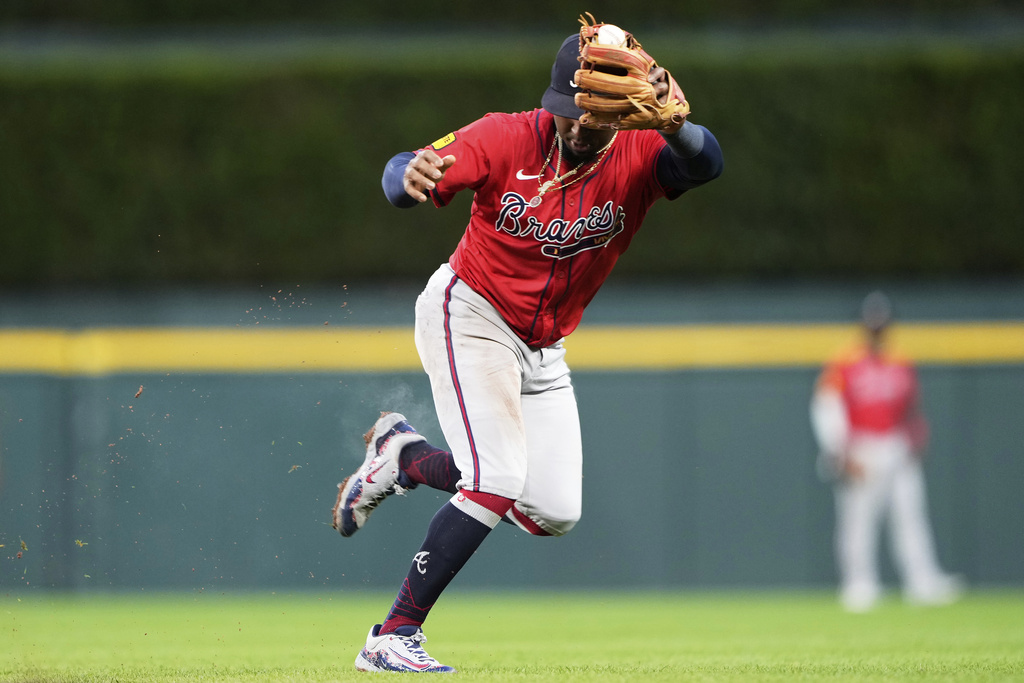 Atlanta Braves second baseman Ozzie Albies fields a ground out from Detroit Tigers' Zach McKinstry during the third inning of a baseball game, Friday, Sept. 19, 2025, in Detroit. (AP Photo/Ryan Sun)