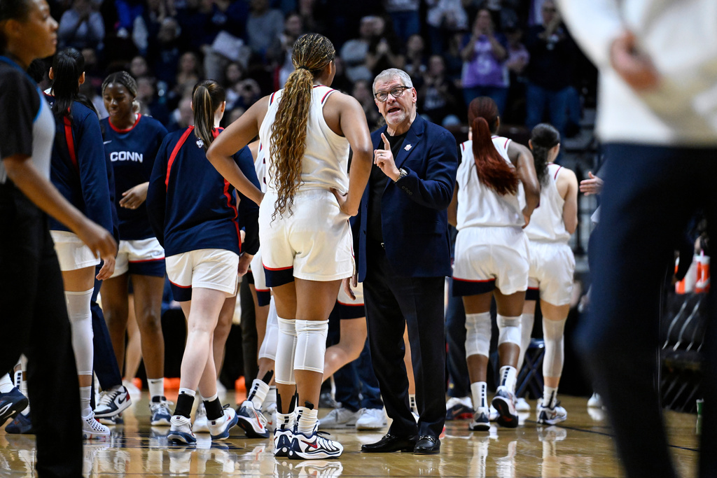 UConn head coach Geno Auriemma talks with forward Sarah Strong during first half of an NCAA college basketball game against Creighton in the semifinals of the Big East tournament, Sunday, March 8, 2026, in Uncasville, Conn. (AP Photo/Jessica Hill)