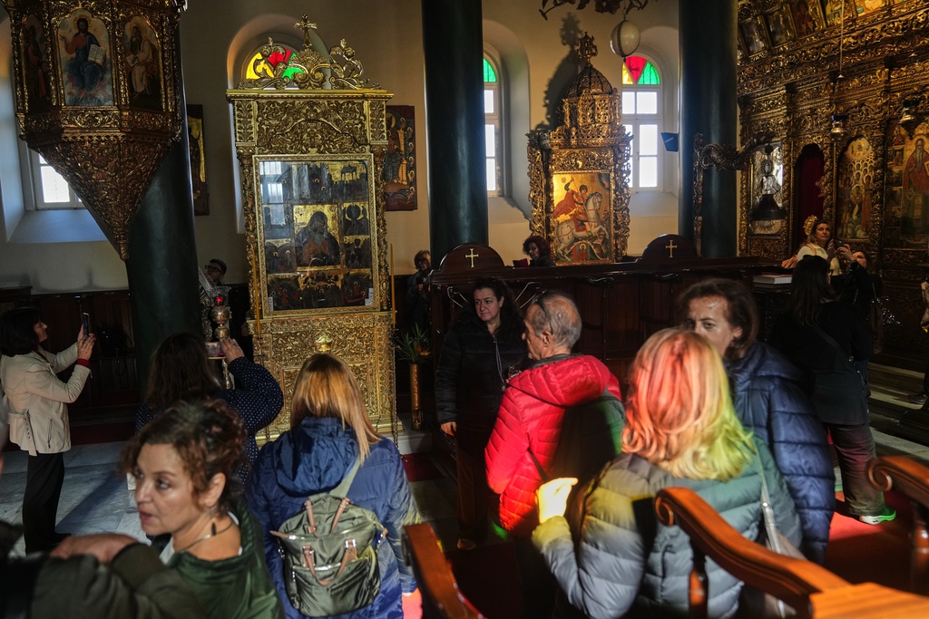 Greek pilgrims visit the church of the Christian Orthodox Holy Trinity monastery, where is also located the Halki Theological school, in Heybeliada island, Istanbul, Turkey, Friday, Nov. 14, 2025. (AP Photo/Francisco Seco)