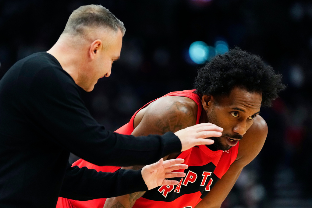 Toronto Raptors head coach Darko Rajakovic speaks with Kawhi Leonard (2) during the second half of an NBA basketball game in Toronto, Wednesday, Oct. 21, 2026. (Frank Gunn/The Canadian Press via AP)