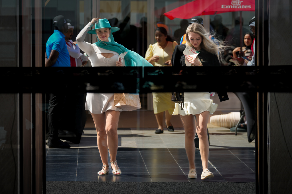 Racegoers arrive at the grandstand ahead of the Dubai World Cup at Meydan Racecourse in Dubai, United Arab Emirates, Saturday, March 28, 2026. (AP Photo/Altaf Qadri)