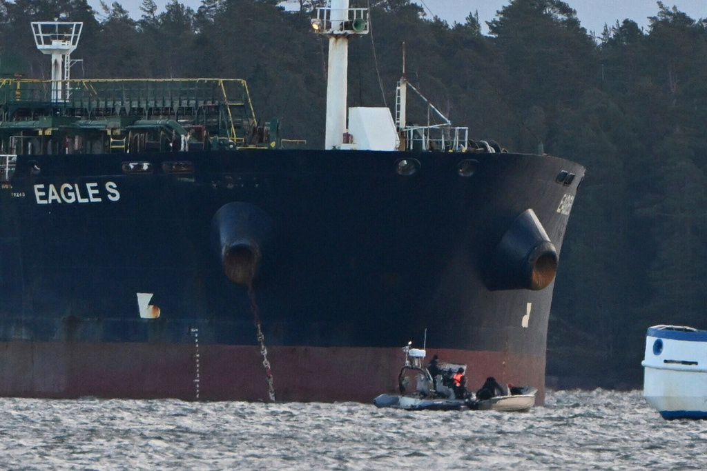 FILE - Finnish Coast Guard stops a small boat which tried to reach the Cook Islands-registered oil tanker Eagle S anchored near the Kilpilahti port in Porvoo, on the Gulf of Finland, on Dec. 30, 2024. (Jussi Nukari/Lehtikuva via AP, File)