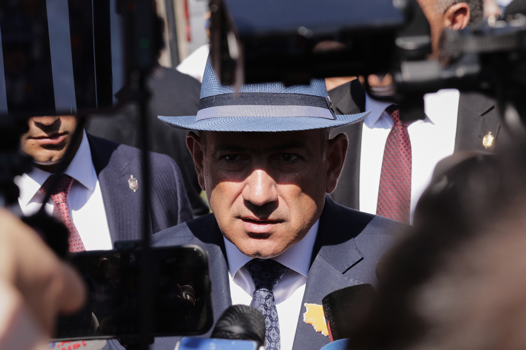 Armenian Prime Minister Nikol Pashinyan speaks to journalists after voting at a polling station during the parliamentary election in Yerevan, Armenia, Sunday, June 7, 2026. (AP Photo/Anthony Pizzoferrato)