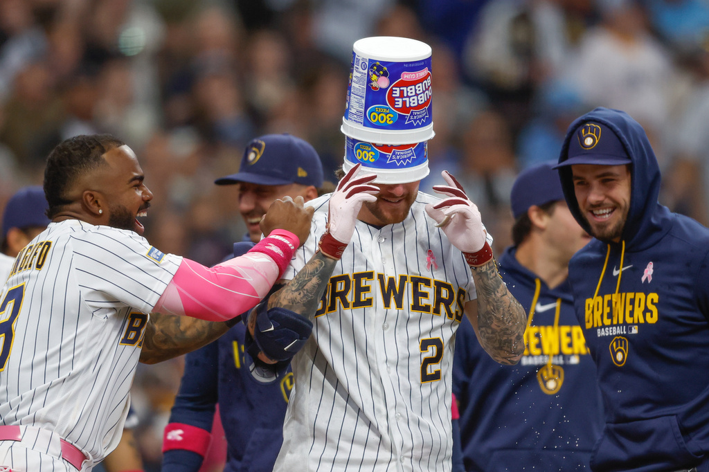 Milwaukee Brewers' Brice Turang (2) reacts with teammates after his walk off home run in the ninth inning against the New York Yankees, Sunday, May 10, 2026, in Milwaukee. (AP Photo/Jeffrey Phelps)