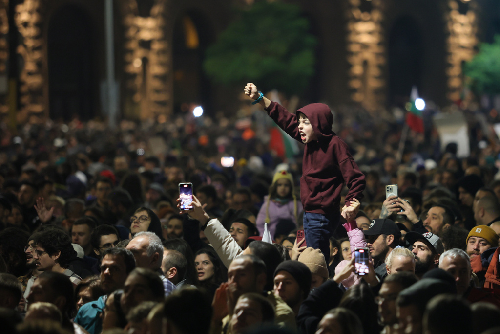 A young protester shouts anti-government slogans as thousands took to the streets of Bulgaria's capital, Sofia, to denounce steep tax hikes in next year's draft budget before being finally voted on in parliament, Wednesday, Nov 26, 2025. (AP Photo/Valentina Petrova)