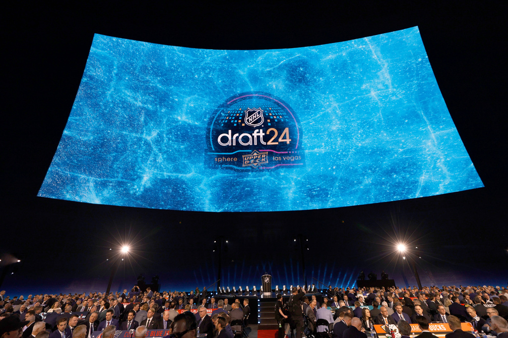 FILE - A screen displays a logo before the NHL hockey draft, Friday, June 28, 2024, at the Sphere in Las Vegas. (AP Photo/Steve Marcus, File)